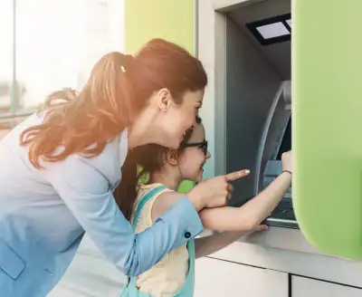 Girl at bank with parent